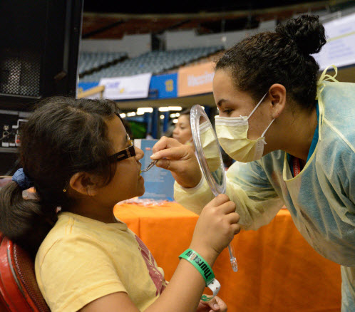 a young person receiving free dental care at a previous Care Harbor event