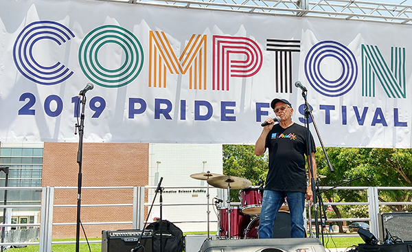 L.A. Care CEO John Baackes speaking onstage at Compton PRIDE