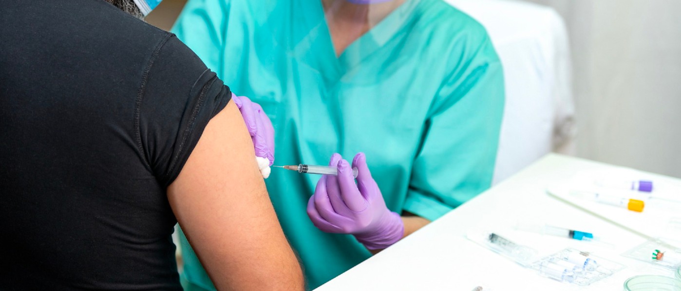 Nurse giving a patient a vaccine