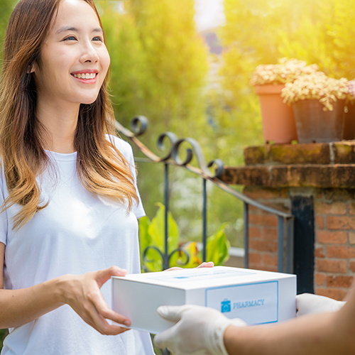 woman getting pharmacy delivery