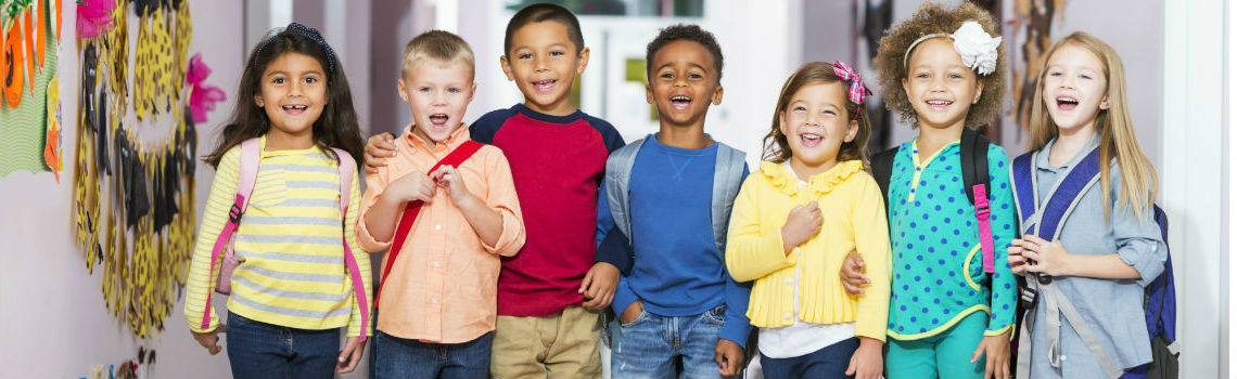 Smiling children in school hallway