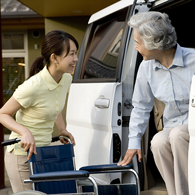 a nurse with a wheelchair for a patient