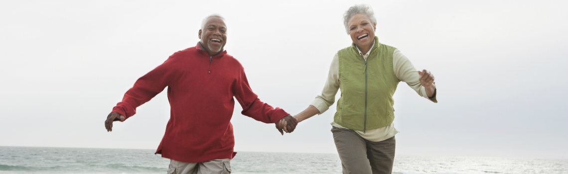 couple exercise at the beach