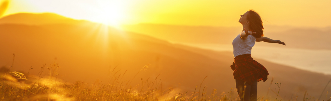 woman greeting the sunrise