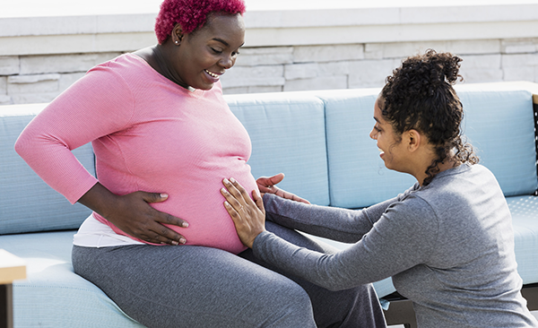 woman with a pregnant woman