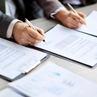 L.A. Care Leadership hands signing documents