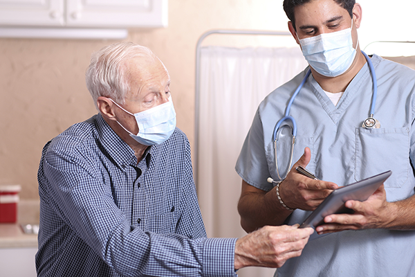 patient going over info with doctor