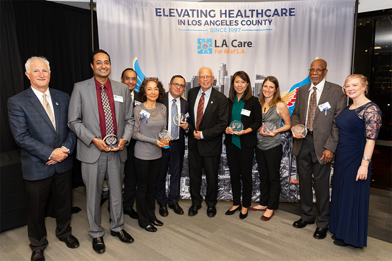 group photo of L.A. Care executives and provider honorees