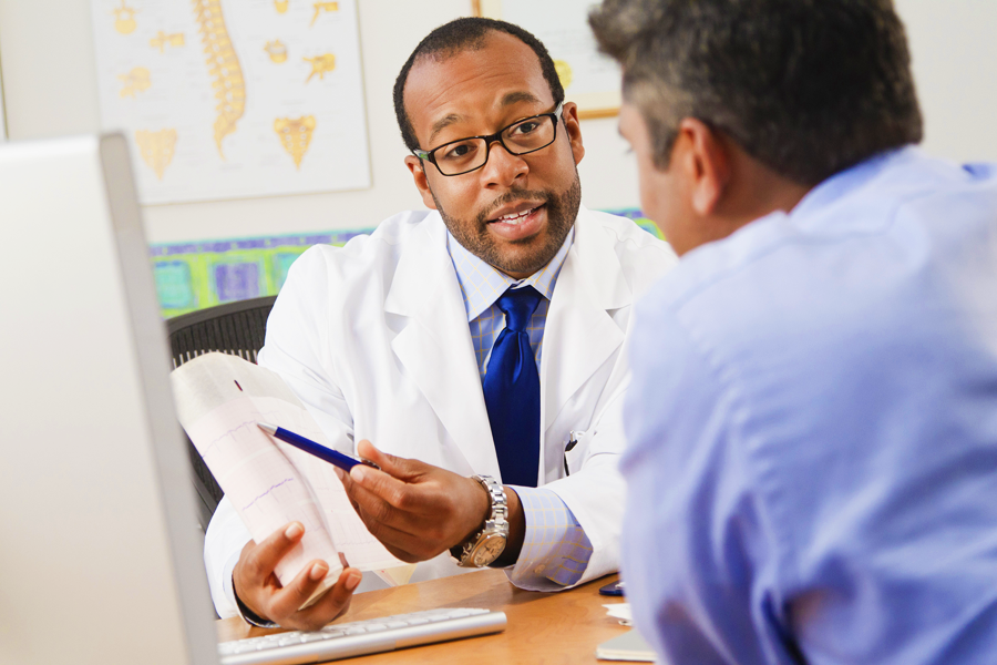 doctor explaining a form to patient