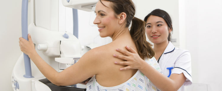 Woman getting mammogram