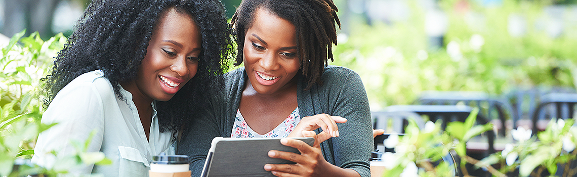 Two women looking at a tablet computer