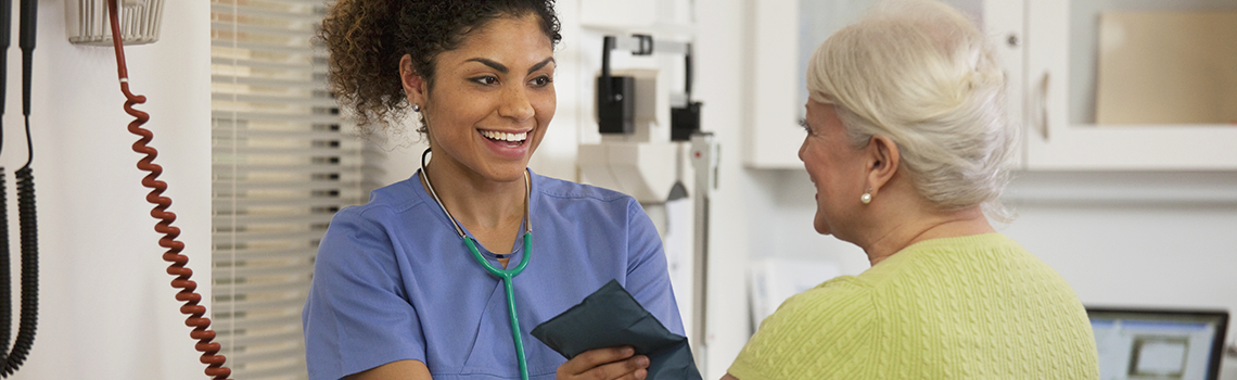 health care provider taking blood pressure of a patient