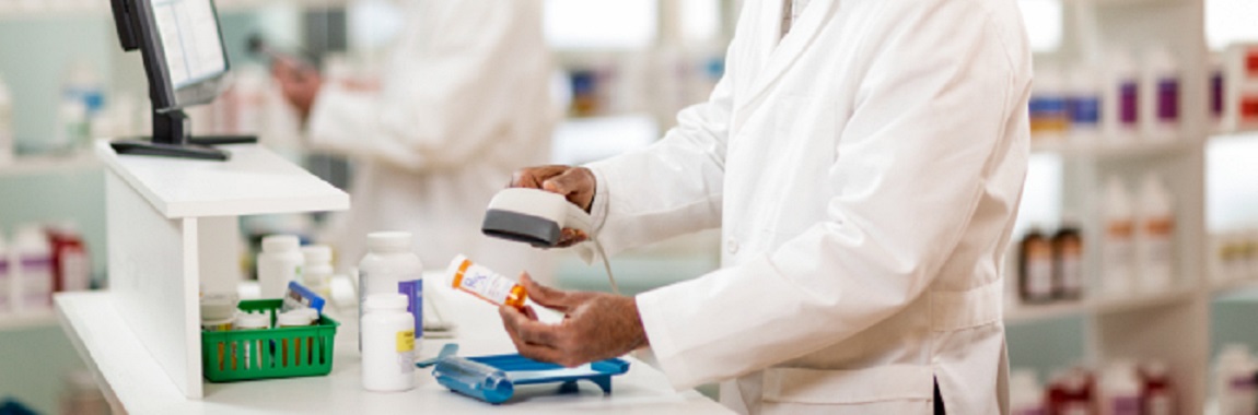 Pharmacist scanning a prescription container