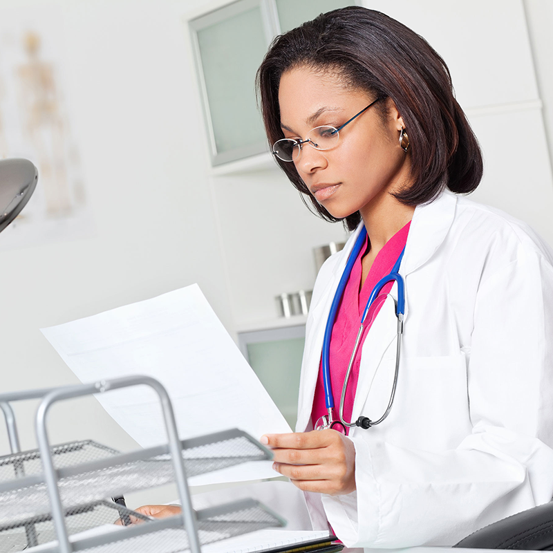 a doctor reading a letter