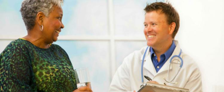 Woman talking to doctor